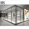 Custom Golden Stainless Steal Window Clear Glass Elliptical Hollow Out Display 3D Rendering For Creative Shop Interior Design