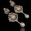 Gold plated earrings in real polki stones with antique polish
