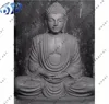 grey sandstone buddha statue and wall panel