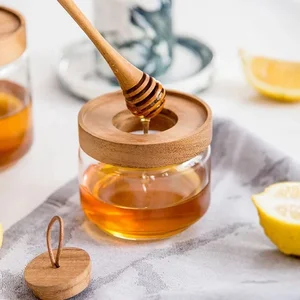 Image of wholesale cheap glass honey jar with wood lid and spoon