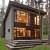 Super insulated Black-painted aluminium window frames surround the large triple-glazed windows.
