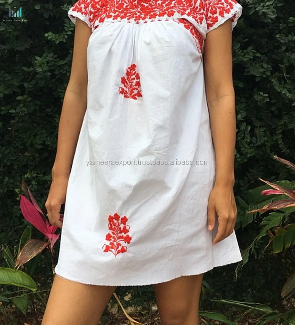 white dress with red embroidery
