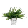 artificial wall plant leaves bush fern making row of leaves potted plant plastic simulation