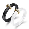 Ceramic couple ring with zircon encrusted black and white couple semicircle gold metal couple ring