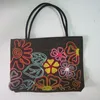 Silk handbag with flower detail made from beads